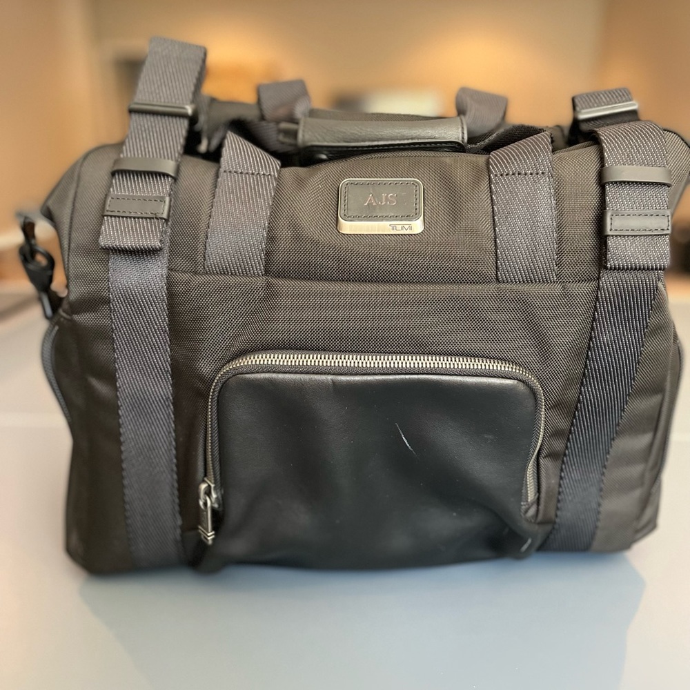 Tumi Duffel Bag - black. Pre-owned good condition.